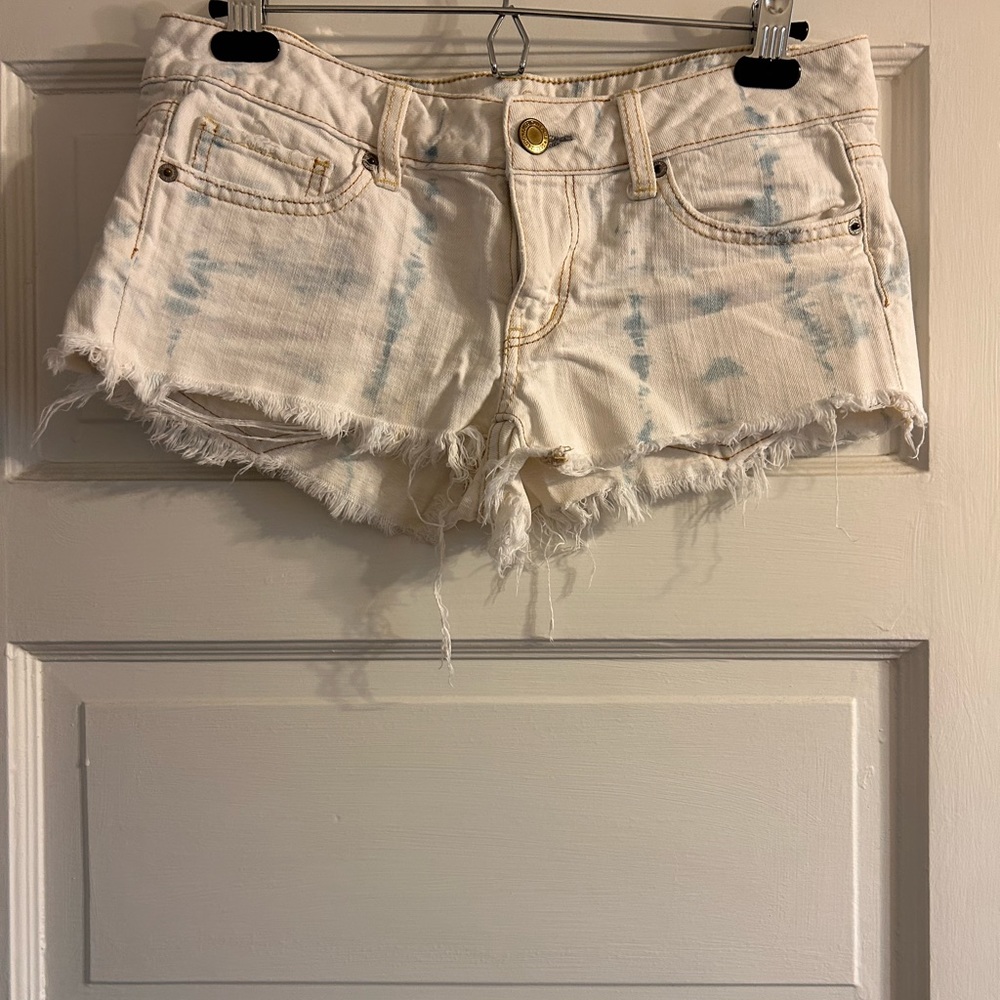 White denim shorts with faded blue denim